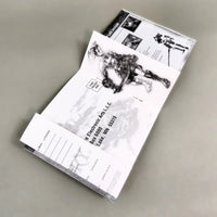 Vagrant Story for PlayStation 1 - Open instruction booklet showing center pages with intact registration card and staple binding, like new condition