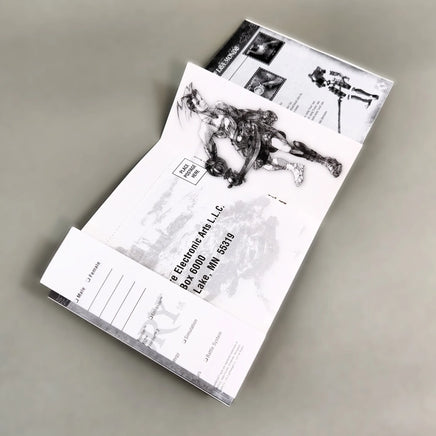 Vagrant Story for PlayStation 1 - Open instruction booklet showing center pages with intact registration card and staple binding, like new condition