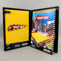 A PS4 game from Acclaim/SEGA 'Crazy Taxi' game case shown open, displaying the yellow cover on the left and the strategy guide insert on the right, photographed on a neutral light gray background.