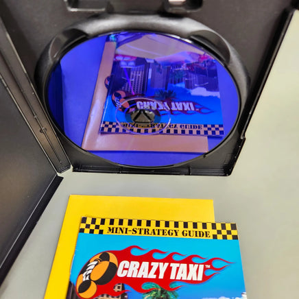 Crazy Taxi [Bonus: Mini-Strategy Guide Enclosed] for PlayStation 2 - Scratch-free game disc underside with mirror finish, like new condition