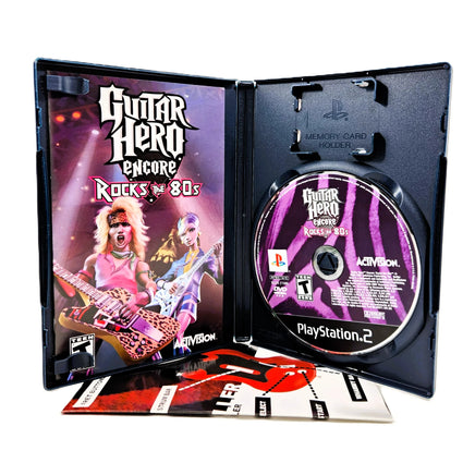 Guitar Hero Encore Rocks The 80'S for PlayStation 2 - View of Open Case Disc & Manual, good condition CIB