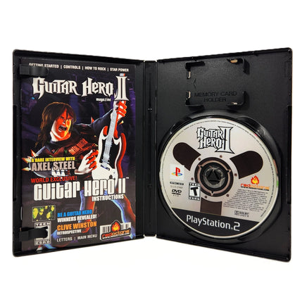 Guitar Hero II PlayStation 2 Very Good - CIB Genuine Release View of Open Game Case Showing Disc and Instruction Manual