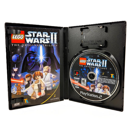 LEGO Star Wars II: The Original Trilogy for PlayStation 2 - Open case displaying contents, good condition
