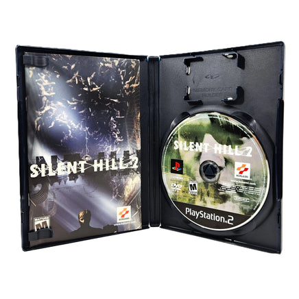 Silent Hill 2 for PlayStation 2 - Open case showing disc and instruction manual, like new CIB condition