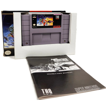 Battle Clash Super Nintendo Brand New - View of official game cart inside inner cardboard tray with instruction manual