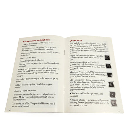 Zombies Ate My Neighbors Super Nintendo Very Good CIB - View of official instruction manual open showing staple binding