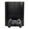 PlayStation 3 Super Slim 250GB Console System Bundle Black Carbon Fiber Skin Very Good Loose - View 1 Top of console Standing On End with Control Pad In Front