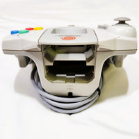 White Sega Dreamcast controller shown from Top with colorful buttons on a white background