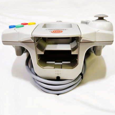 White Sega Dreamcast controller shown from Top with colorful buttons on a white background
