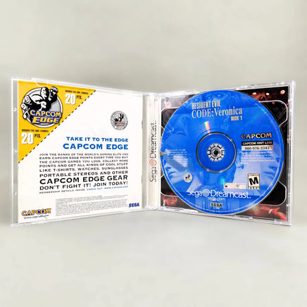 Resident Evil: CODE Veronica - Sega Dreamcast - Interior layout showing disc 1 placement & back of manual, very good condition