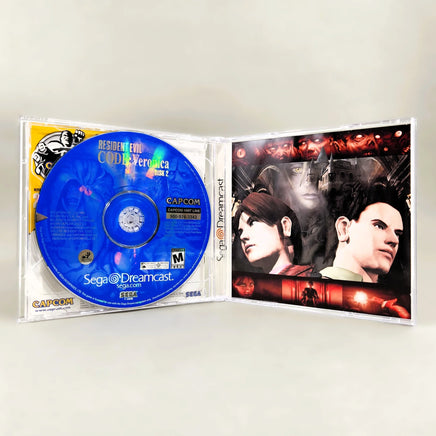 Resident Evil: CODE Veronica - Sega Dreamcast - Interior layout showing disc 2 placement & rear tray artwork, very good condition